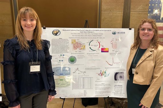 Ashley Jensen and Emma Olson with their research poster