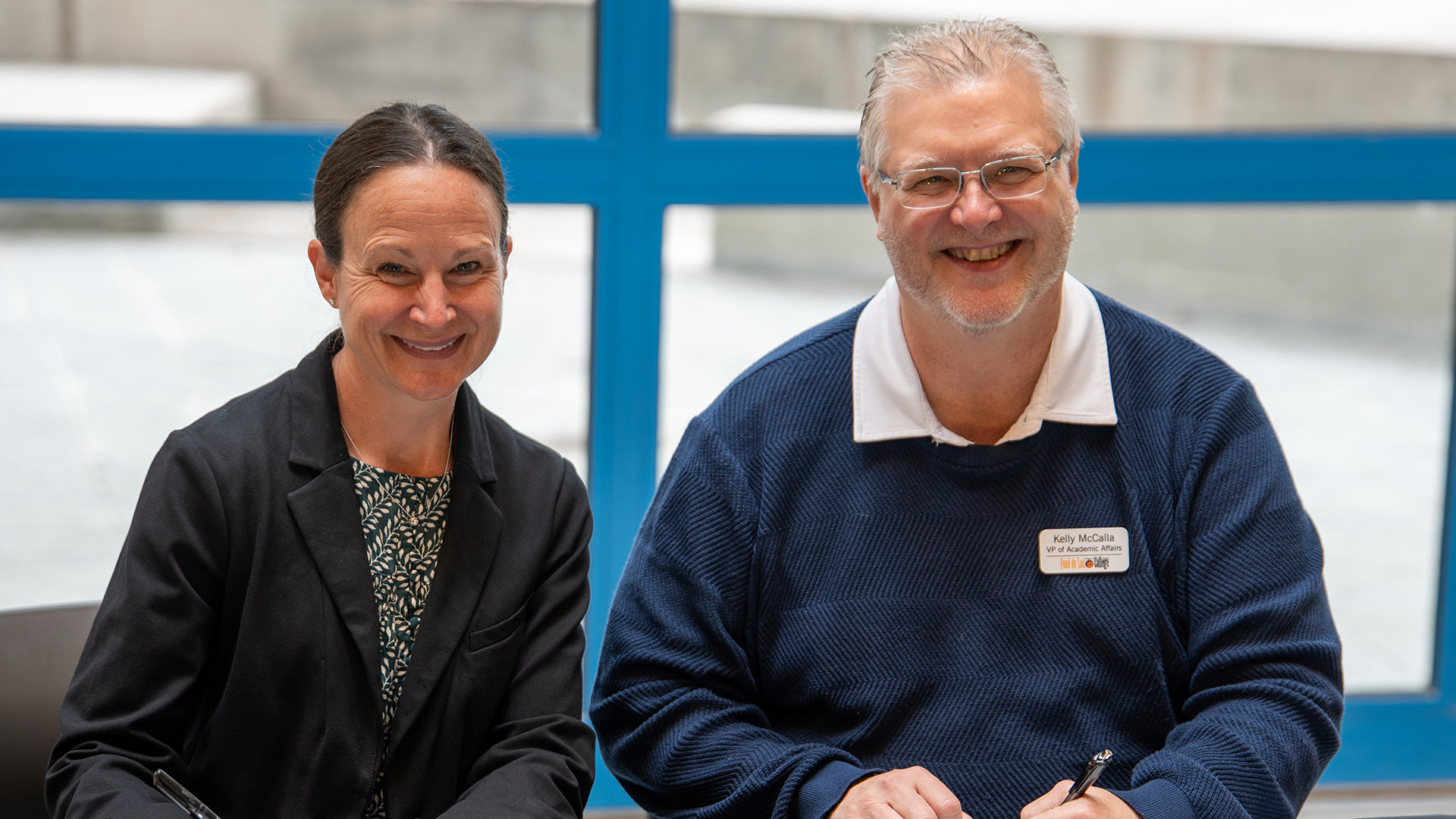 BSU Provost & Vice President for Academic Affairs Marah Jacobson and Alexandria Community and Technical College Vice President Kelly McCalla smile after signing contracts.
