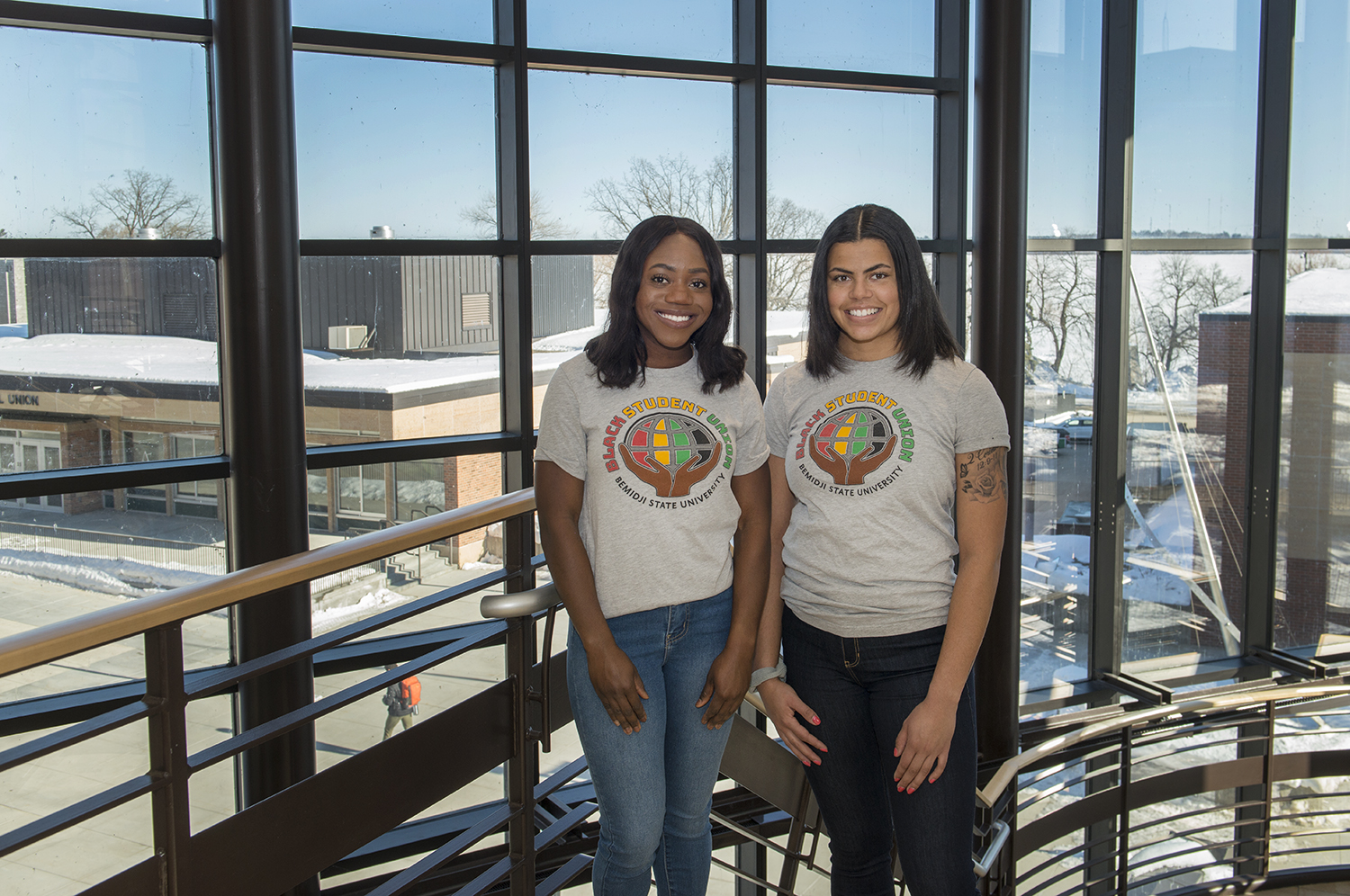 Two students wearing Black Student Union shirts