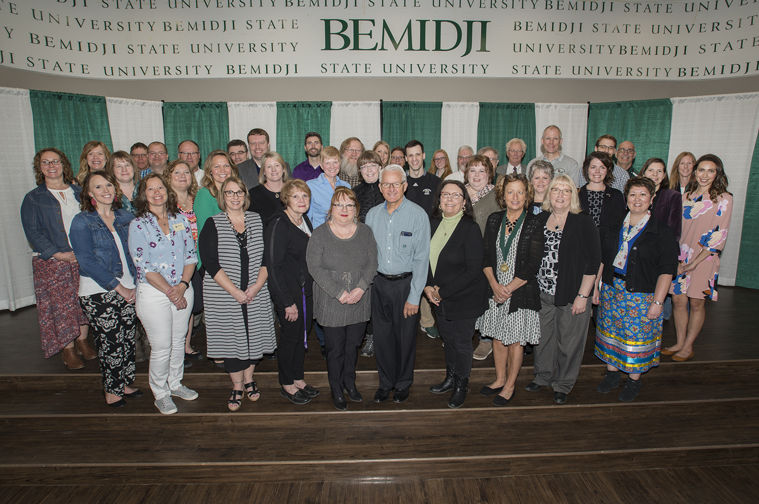 A group of BSU employees in the ballroom celebrating