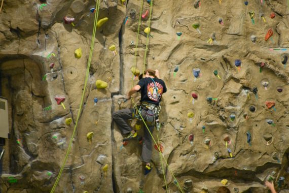 BSU student climbing a rock wall