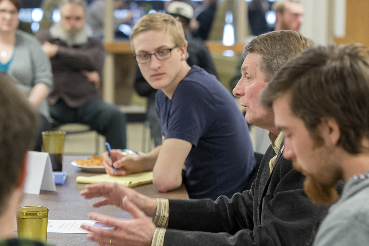 Minnesota State Rep. John Persell answers questions in a meeting with Political Science students