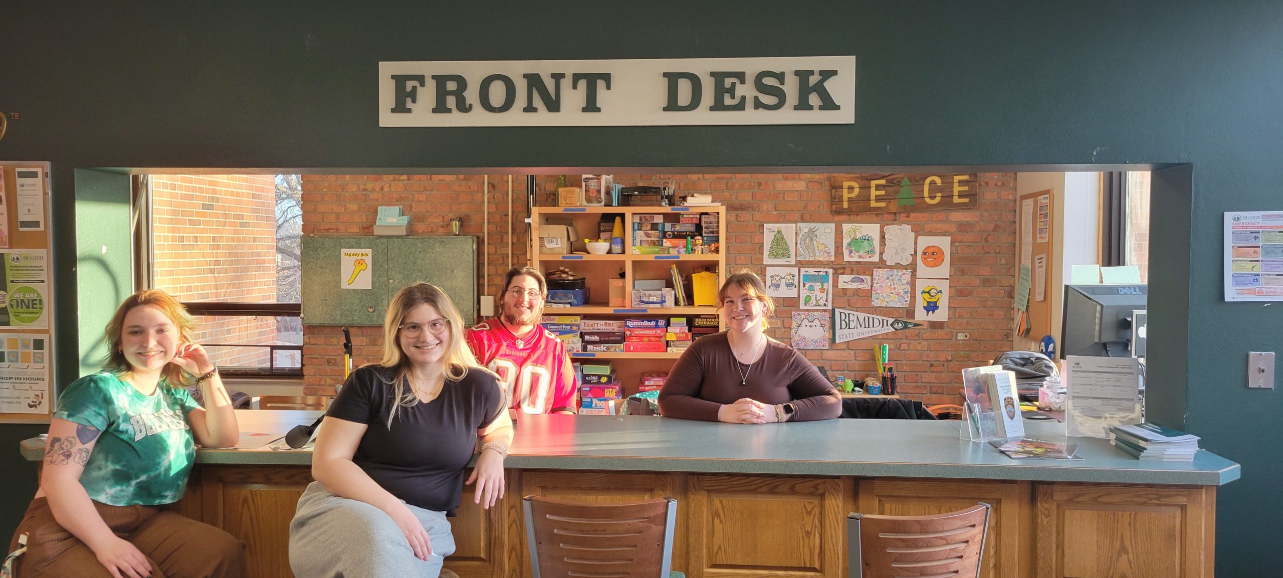Students sitting at the Tamarack Hall Front Desk