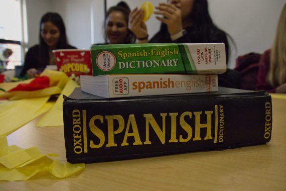 Students participating in the spanish language table