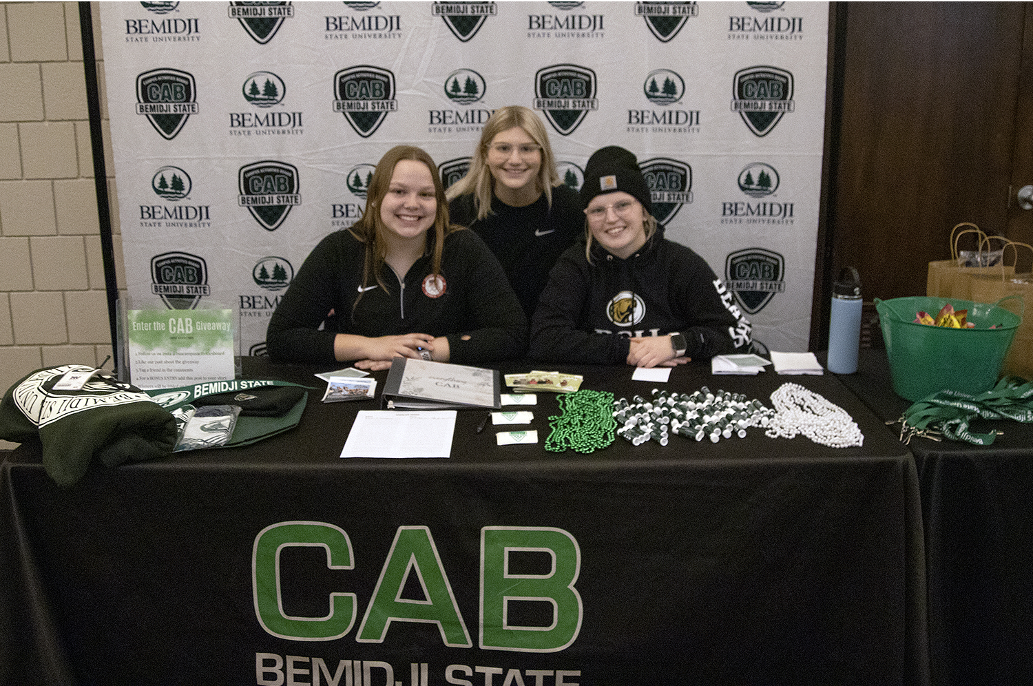 The campus activity board posing at their booth