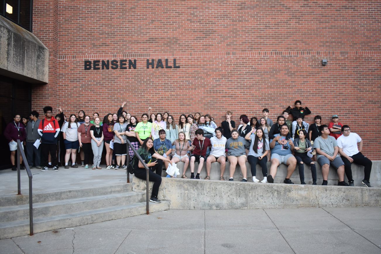 Upward Bound group standing outside of Bensen Hall at Bemidji State University